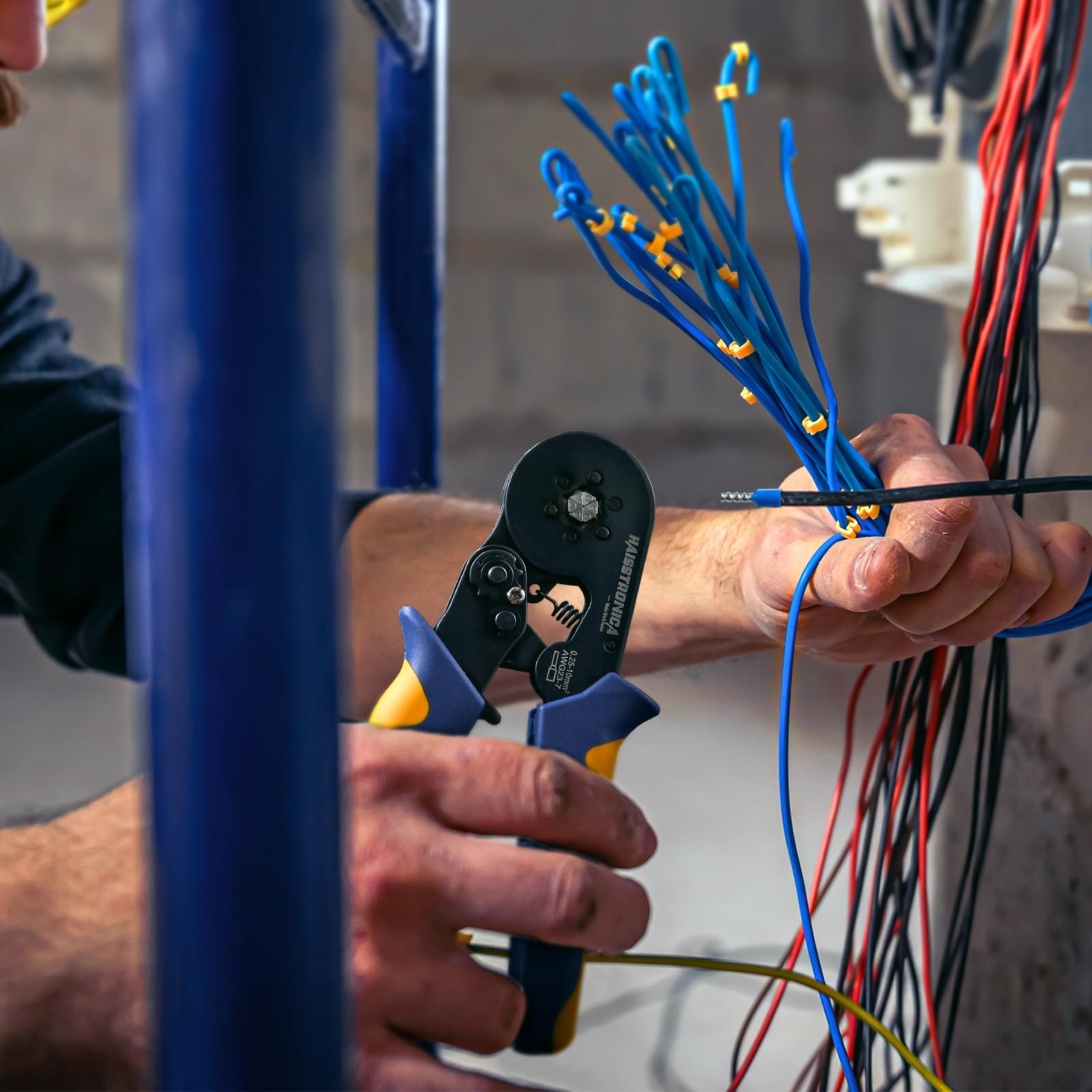 Wire Ferrule Crimping Tool usage, hands work on electrical setup with red/black wires.