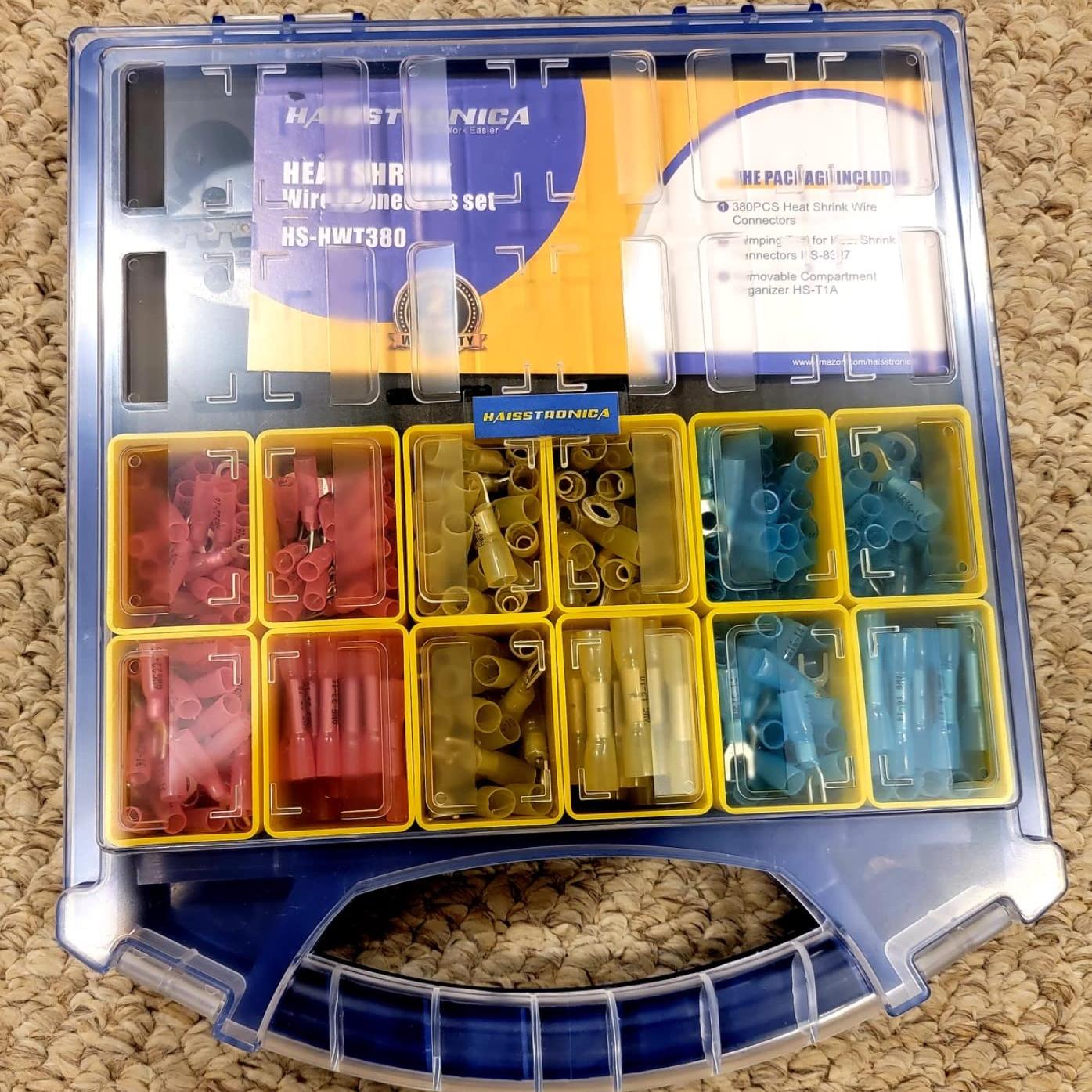 Portable case loaded with color‑coded wire connectors solder sleeves and terminals; removable bins enable fast access and neat storage.