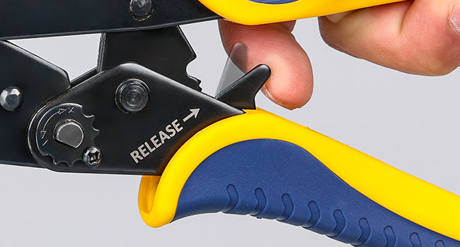 Electrical crimper close-up highlighting ratchet release mechanism and ergonomic handle for controlled crimp force.