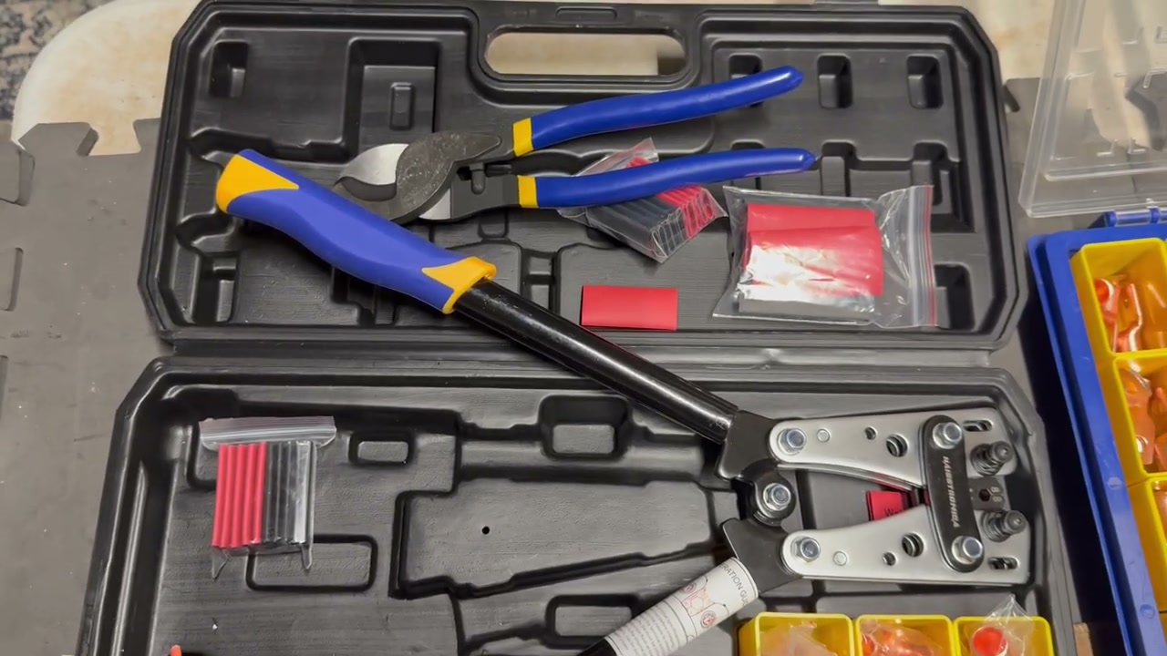 Authorized JonesingForTools video frame showing the battery cable crimping kit layout