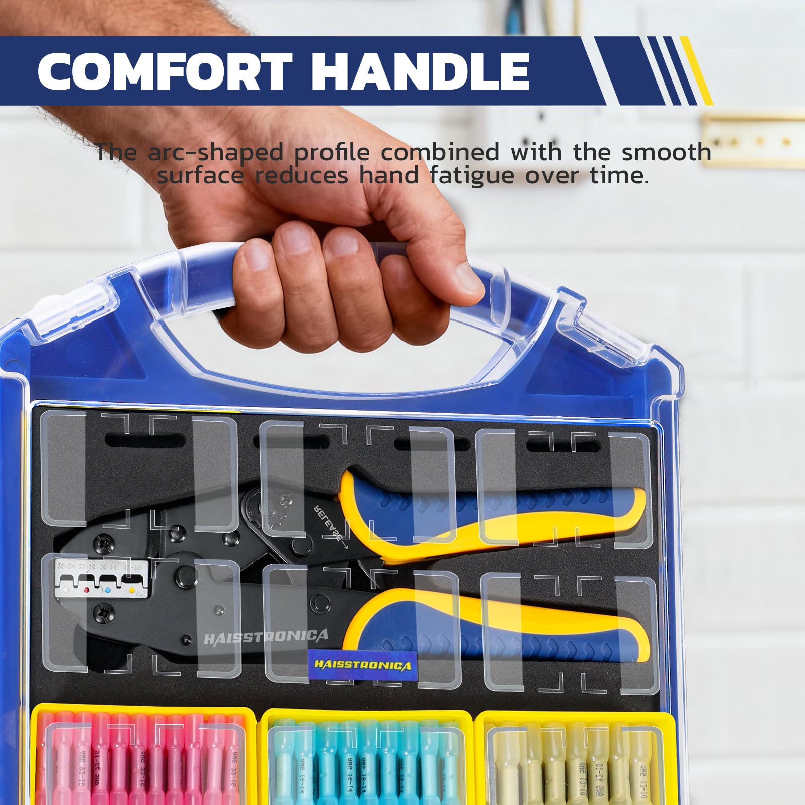 Hand carrying a blue organizer by its handle, with a ratcheting crimper and red, blue and yellow butt connectors visible through the clear lid.