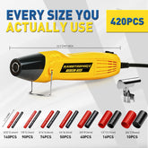 Mini heat gun for shrink tubing in workshop environment with multiple heat shrink connectors and organized supplies.